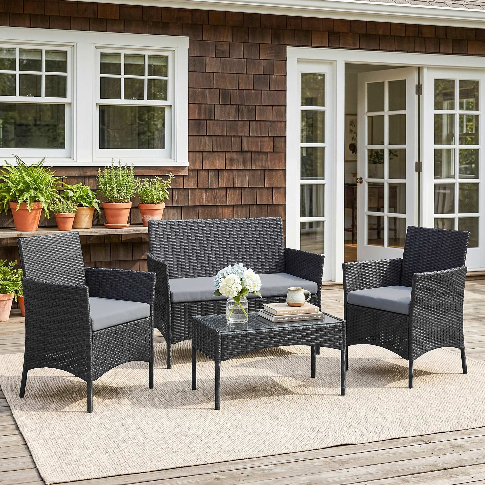 Amalfi 4 Piece Rattan Garden Furniture Sofa Set with Loveseat, Armchairs, Glass-Top Coffee Table and Cushions