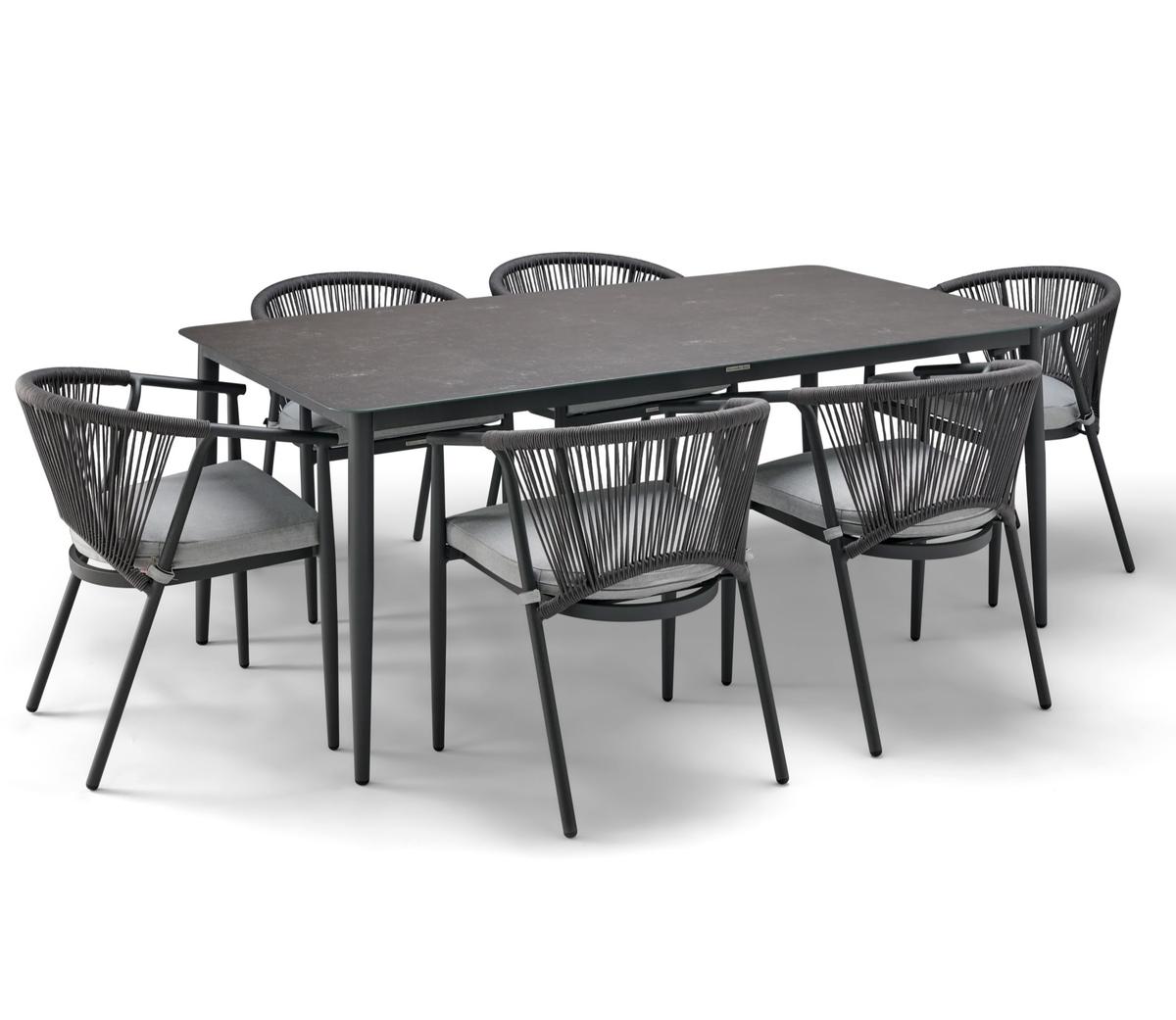 Modern outdoor dining set featuring a sleek rectangular table with a dark finish and six matching rope-woven chairs with grey cushions, ideal for garden settings.