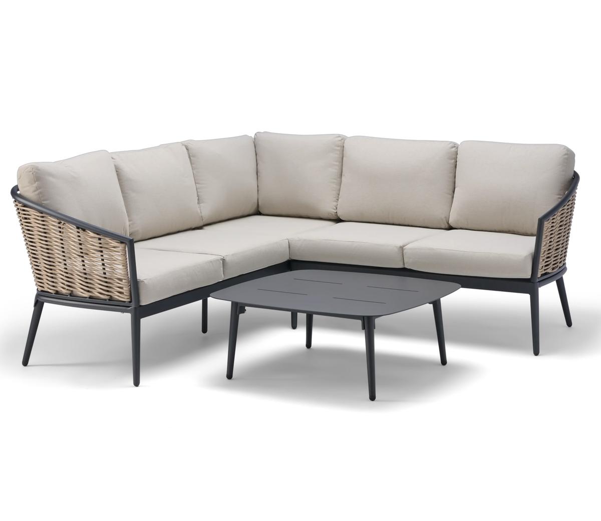 A modern L-shaped corner sofa with neutral beige cushions and a sleek black frame, paired with a matching dark grey rectangular coffee table, perfect for stylish outdoor settings.