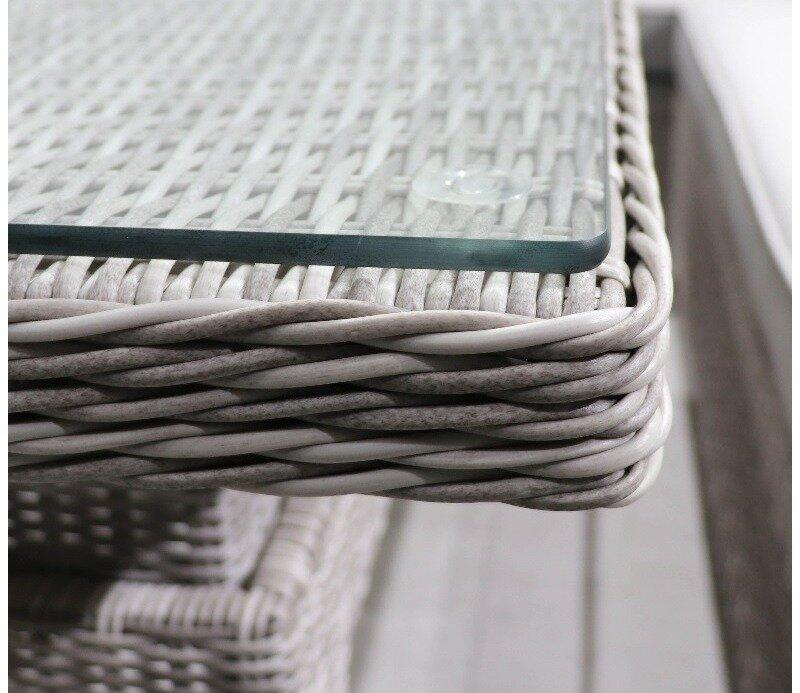 Close-up of a grey wicker outdoor table with a clear glass top, highlighting detailed woven structure and sleek design. Ideal for garden and patio environments.