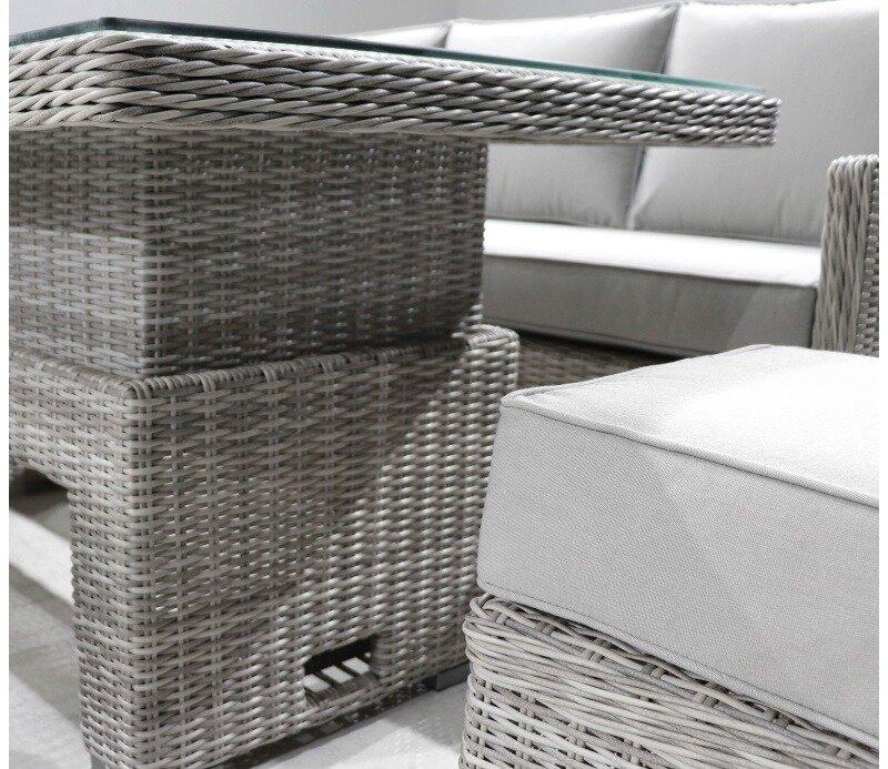 Grey wicker outdoor dining set featuring a glass-top table and cushioned seating. The elegant design blends functionality with style for a patio or garden space.